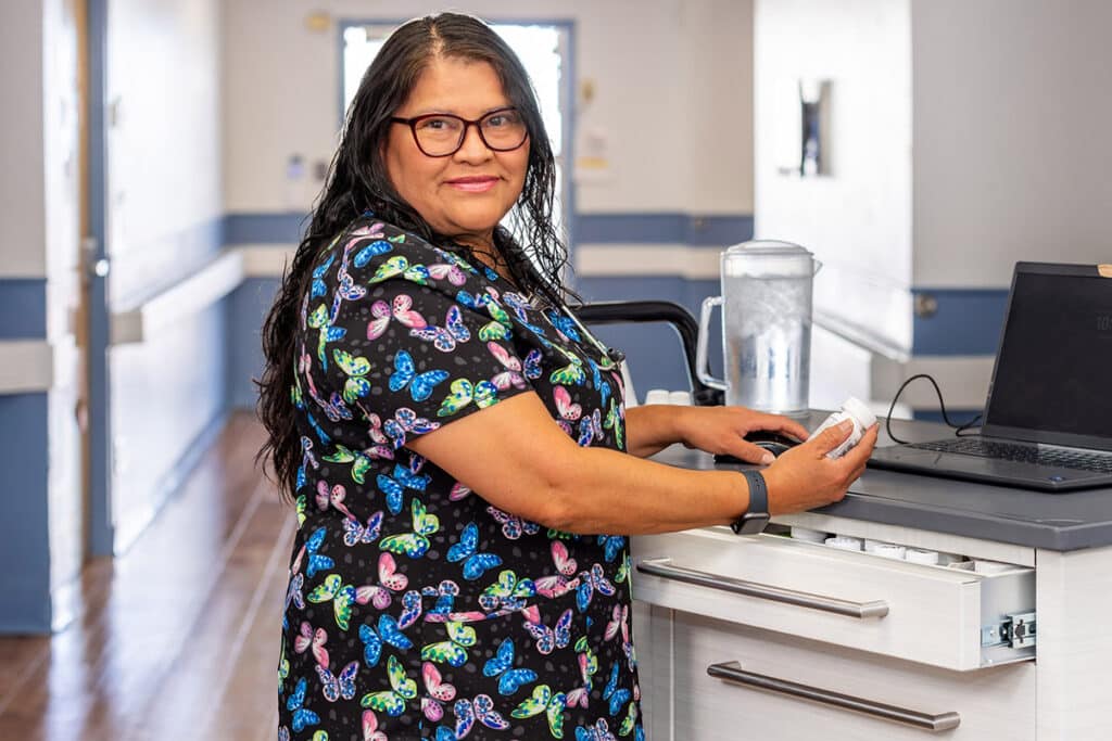Nurse holding medicine at Ahwatukee Post Acute