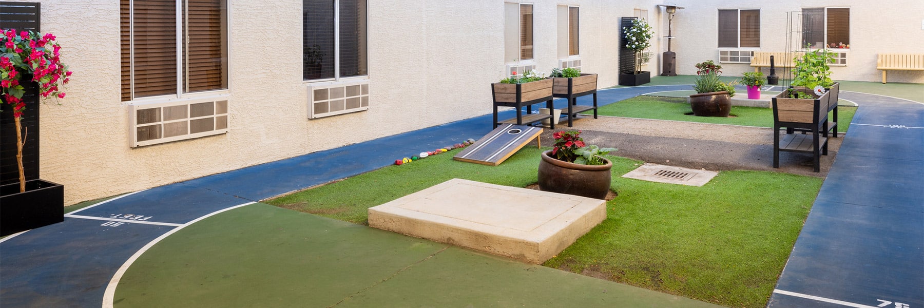 Walking track and flower beds in courtyard at Ahwatukee Post Acute