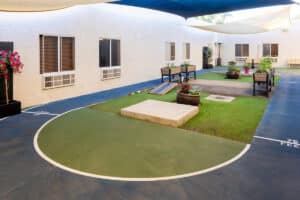Walking track and flower beds in courtyard at Ahwatukee Post Acute
